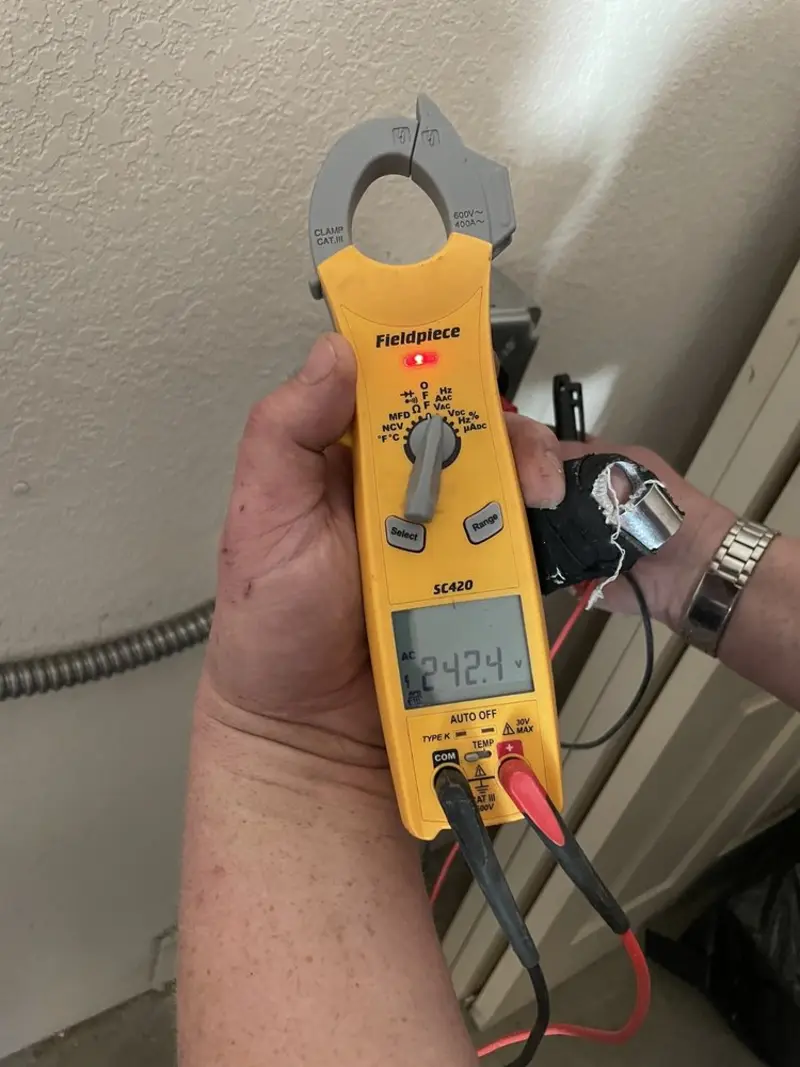 Voltage testing with clamp meter during Recessed Lighting Installation in Farmersville